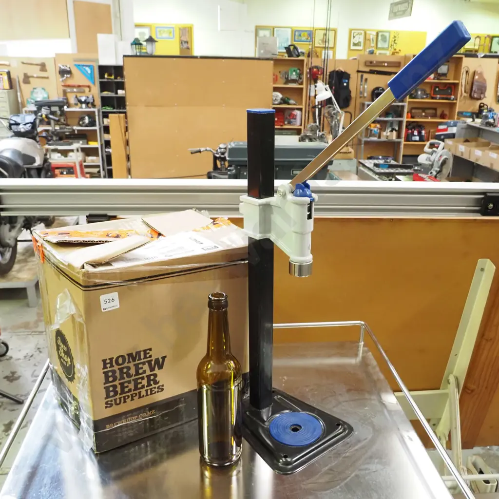 beer bottle capper and box of home brew beer bottles Image 1++