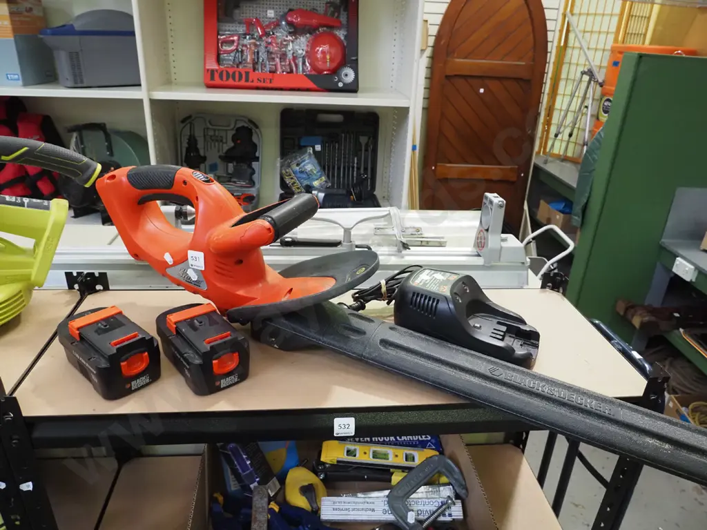Black & Decker Fire storm electric hedge trimmer with 2 batteries and chargers - batteries in office Image 1++