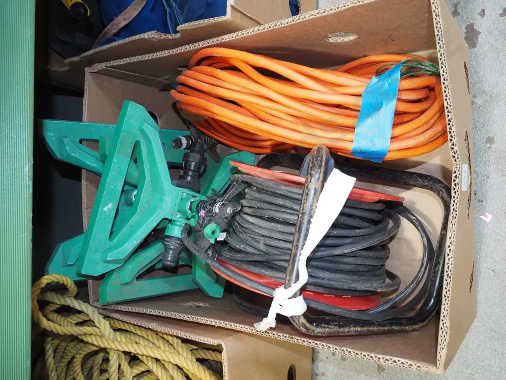 box; garden sprinklers, extension cords Image 1++