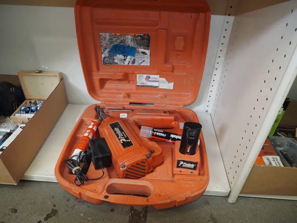 Paslode nail gun in carry case with battery and charger  Image 1++