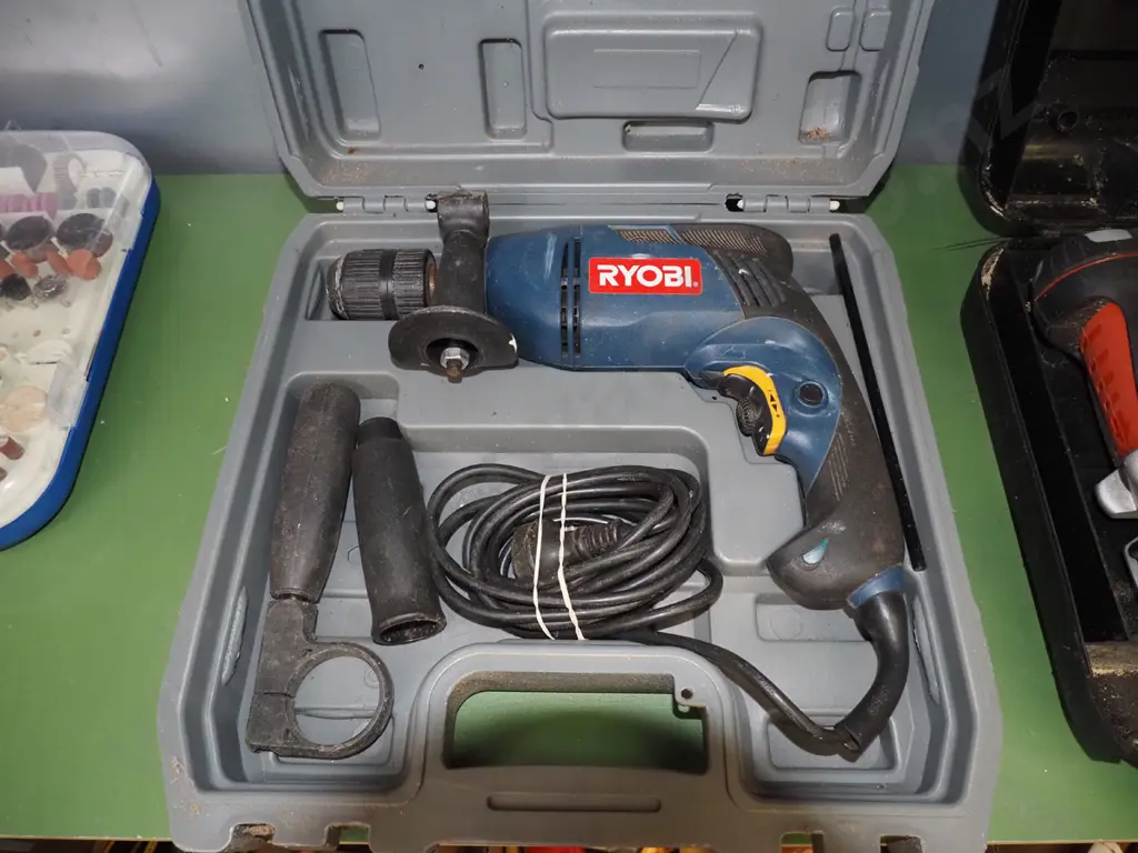cased Ryobi drill Image 1++