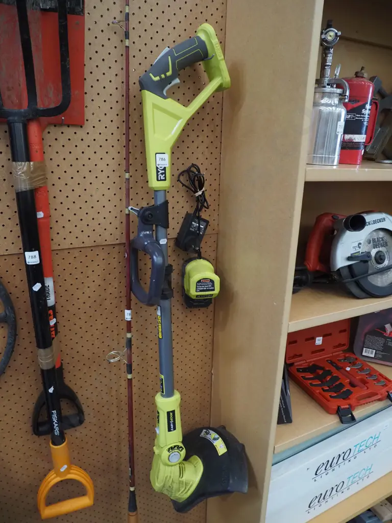 Ryobi battery powered line trimmer - battery in office Image 1++
