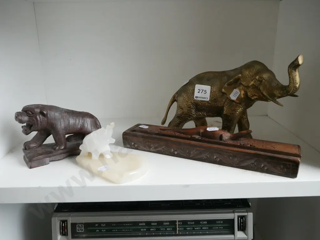 shelf; brass elephant, carved stone tiger, ashtray, carved wooden chopstick box Image 1++