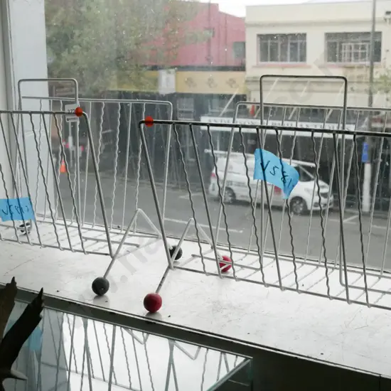pair of retro metal and ball footed magazine racks - orange dots