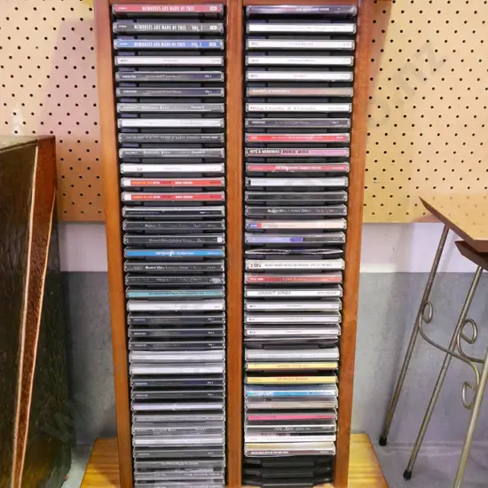 wooden CD tower and CDs H-700