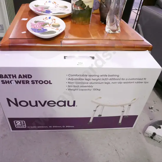 yet to be assembled boxed bath and shower stool