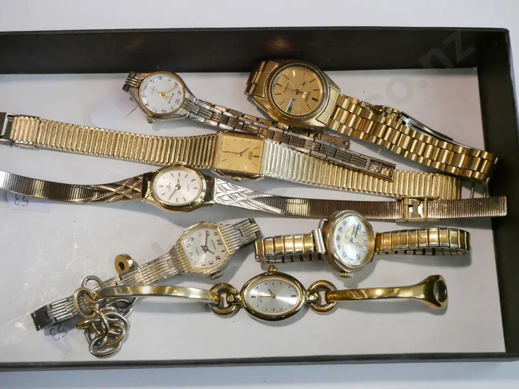 tray of golden wristwatches Image 1++