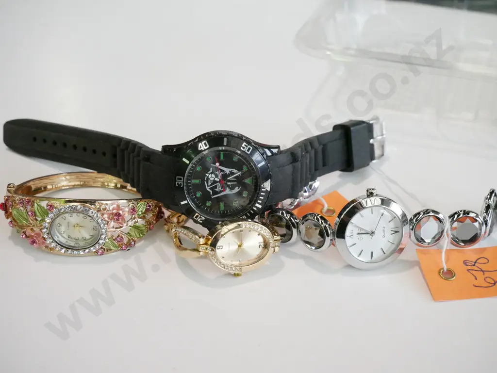 tray of wristwatches Image 1++