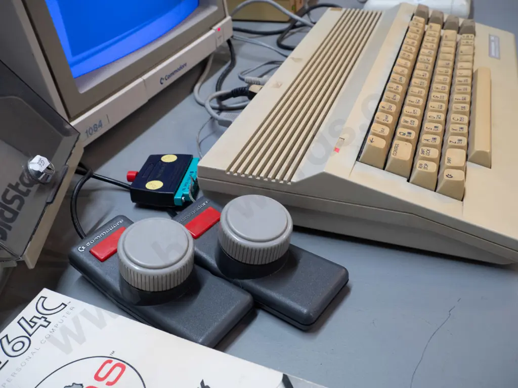 1980s Commodore 64 computer with CRT, tape drive, floppy drive, game cartridges, controllers, floppies etc - powers up, Image 1++