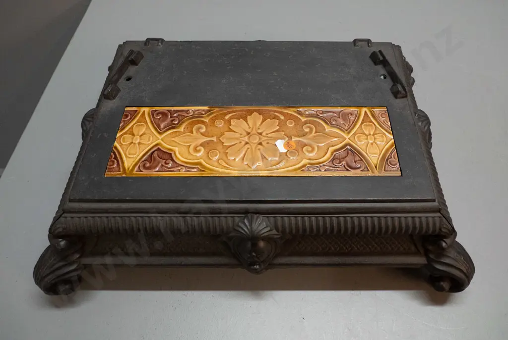 vintage cast iron base from stove or heater - crack to inset floral tile. H-150 W-520 D-390 Image 1++