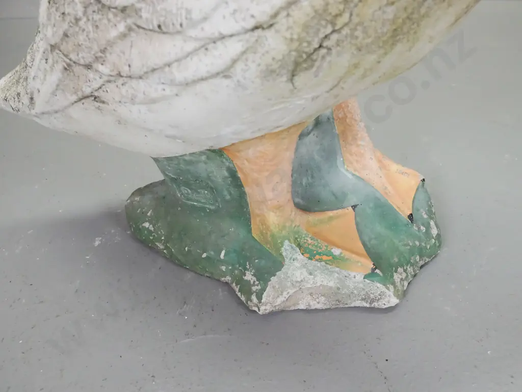 pair of concrete garden geese with painted details, overall lichen and patination, a few chips and a crack that may be a Image 1++