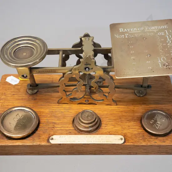 antique oak and brass post office scale with engraved rates on platform, bone plaque & set of weights H-120 W-230