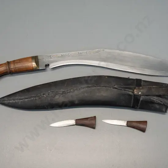 Nepalese kukri-style curved blade dagger with rosewood handle, brass hilt, engraving to blade, leather