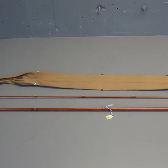 2-piece timber fishing rod in canvas sleeve with Sealey "Octopus" Redditch label - longer section is L-1360