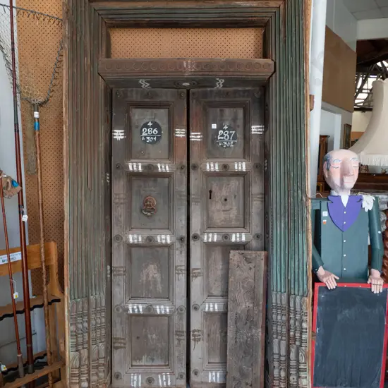 heavy Indian Madurai carved hardwood entrance door - 2 doors, cast metal drop handle, metal studding