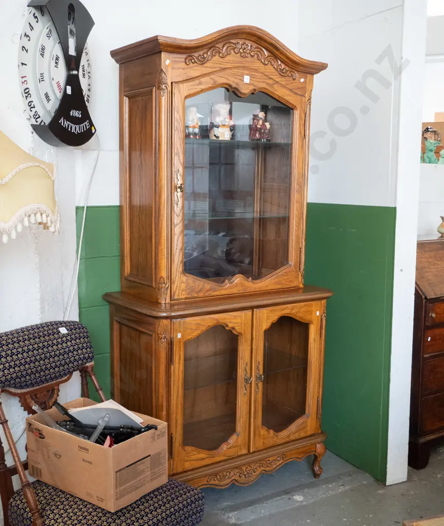 reproduction oak and elm display cabinet with single top and 2 lower glazed shaped cupboard doors, mirrored back on top, Image 1++