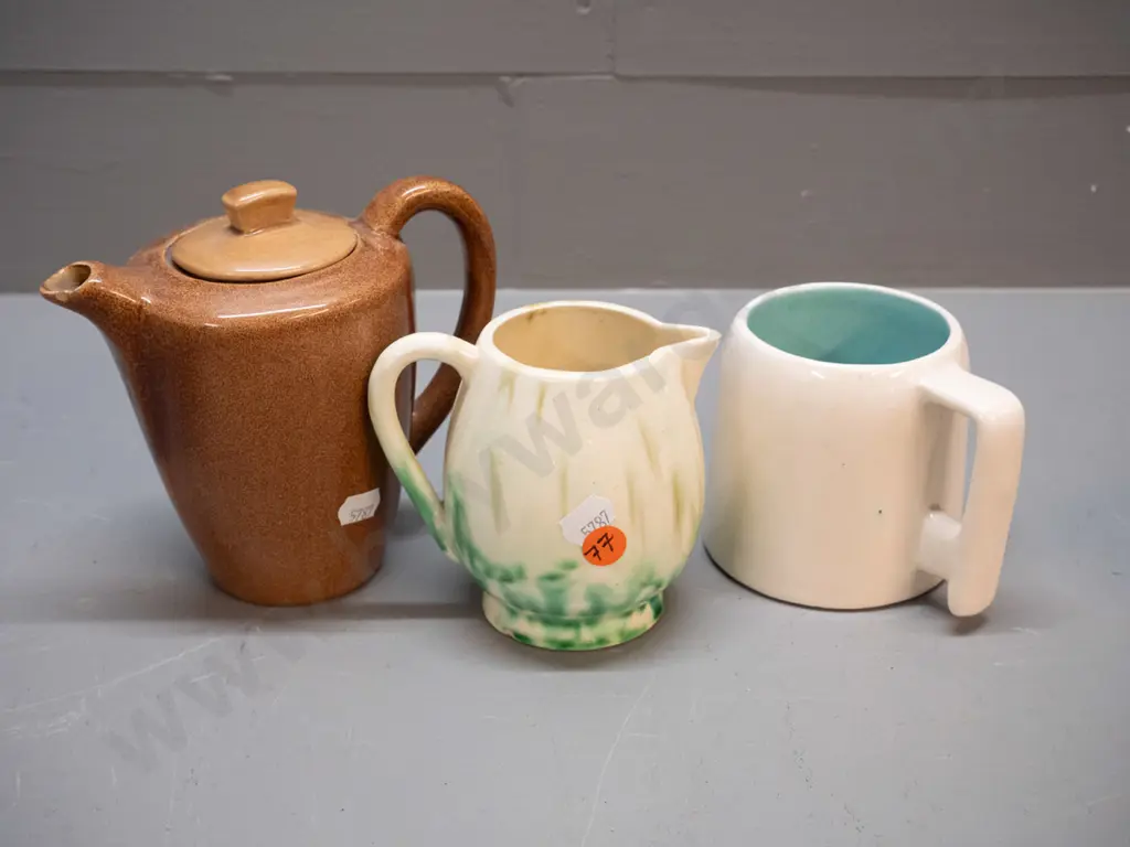 3 pieces of O.C. Stephens pottery - brown teapot, an ivory mug with blue interior, & a cream jug with green mottled jug Image 1++