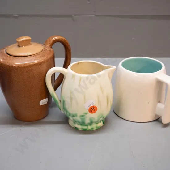 3 pieces of O.C. Stephens pottery - brown teapot, an ivory mug with blue interior, & a cream jug with green mottled jug
