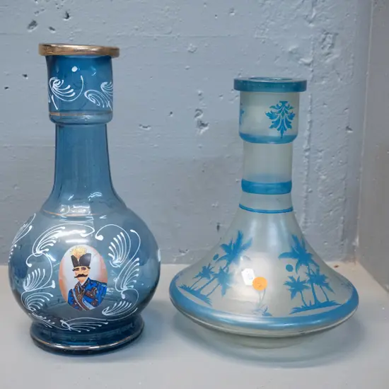 2 vintage glass hookah bottles, one with printed Turkish motifs H-290