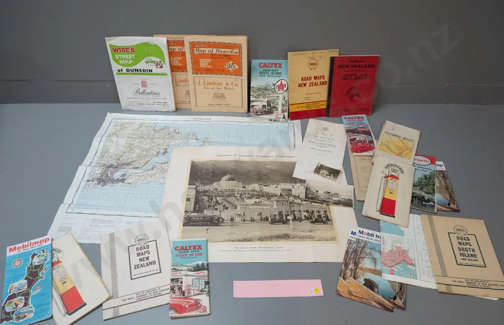 assorted New Zealand road maps and directories, a Dunedin Exhibition print, 2 small photos, and a 1959 map of Dunedin Image 1++