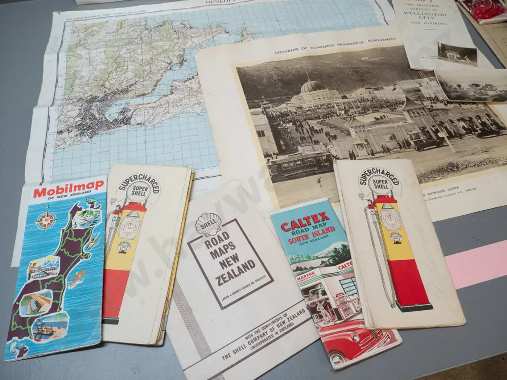 assorted New Zealand road maps and directories, a Dunedin Exhibition print, 2 small photos, and a 1959 map of Dunedin Image 1++
