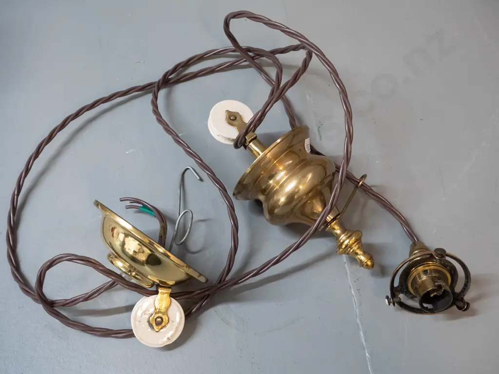 vintage brass rise and fall light fitting with white porcelain wheel, ceiling rose, has been rewired, no shade. Lower Image 1++
