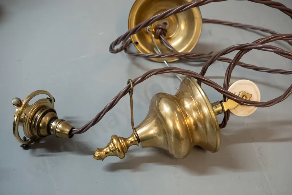 vintage brass rise and fall light fitting with white porcelain wheel, ceiling rose, has been rewired, no shade. Lower Image 1++