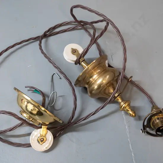 vintage brass rise and fall light fitting with white porcelain wheel, ceiling rose, has been rewired, no shade. Lower