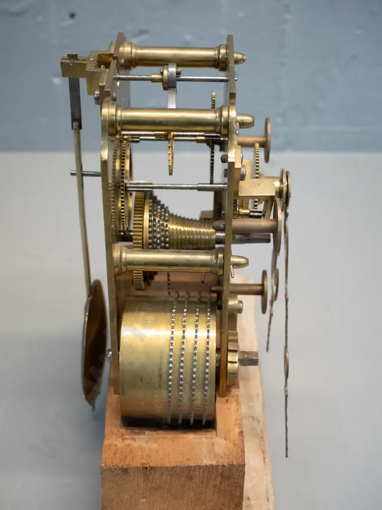 brass "Fusee" clock movement mounted to home made wooden stand, with pendulum key. Note attributes to Humphrey 93, but Image 1++