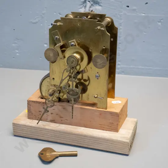 brass "Fusee" clock movement mounted to home made wooden stand, with pendulum key. Note attributes to Humphrey 93, but