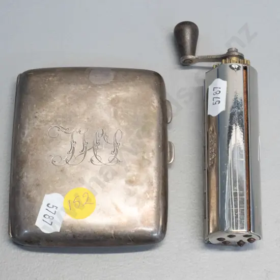 sterling silver cigarette case 70 x 85 and a chrome hand-crank Excelsior cigarette rolling machine