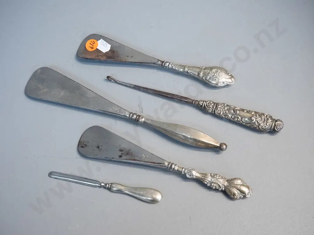 5 sterling silver mounted dressing table items - 3 shoe horns, button hook and nail implement - some dents and corrosion Image 1++