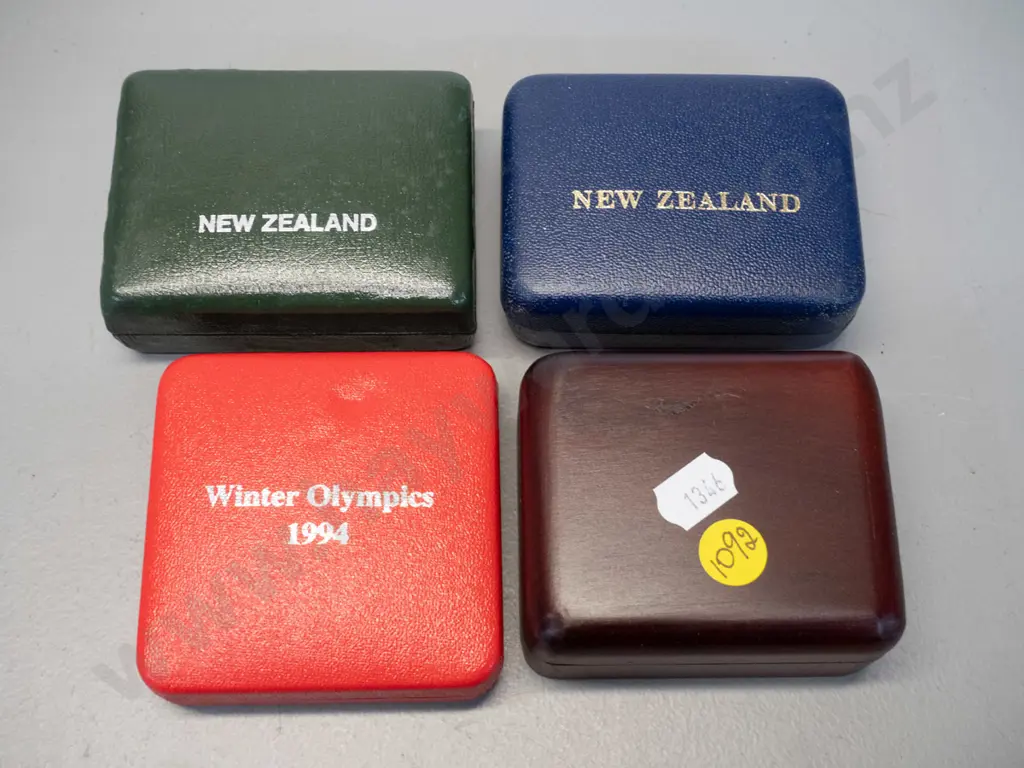 4 boxed coins - 20c coin, one dollar, one dollar commononwealth games & 1994 winter olympics Image 1++