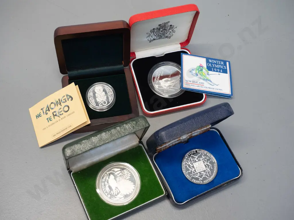 4 boxed coins - 20c coin, one dollar, one dollar commononwealth games & 1994 winter olympics Image 1++