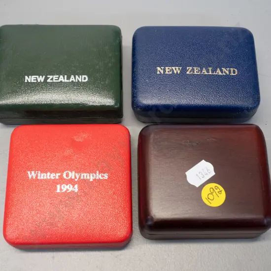 4 boxed coins - 20c coin, one dollar, one dollar commononwealth games & 1994 winter olympics