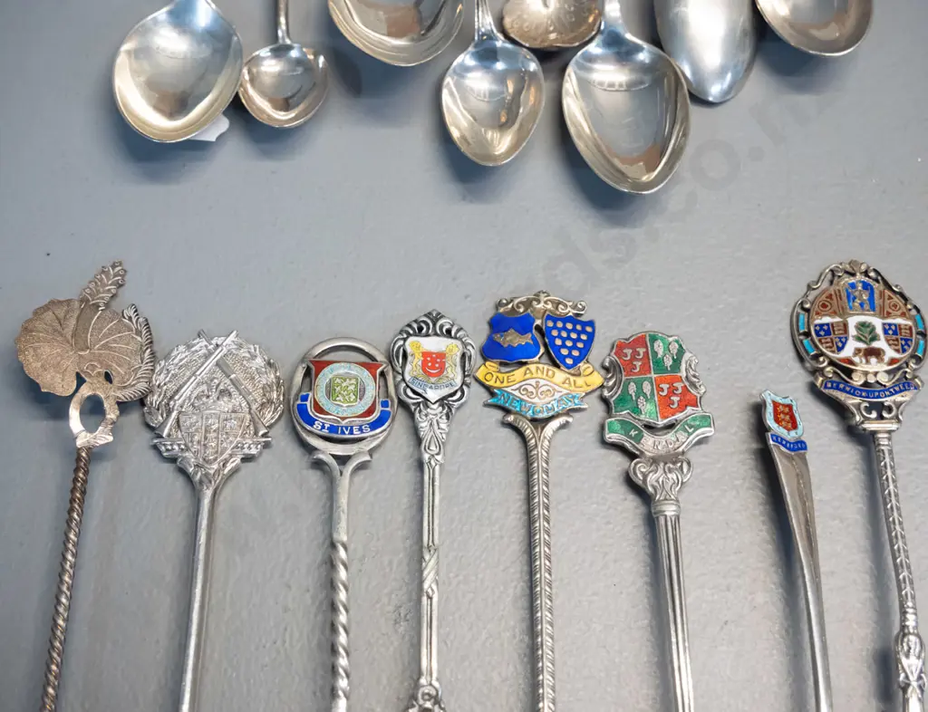 16 assorted sterling silver teaspoons, some place name souvenir, some figural, some with enamel decoration Image 1++