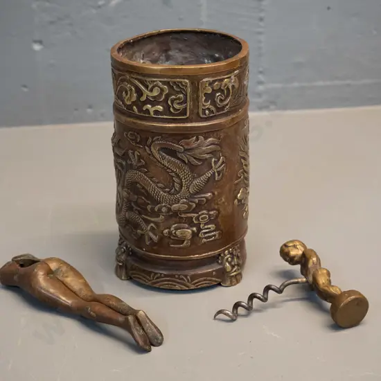 copper and brass vase or brush pot with dragon motifs, may have had repair, H140 D70 and a novelty brass nutcracker and