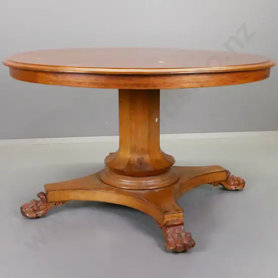 Victorian cedar round tilt-top table on 4-point faceted column base w/carved lion's paw feet, some veneer repairs to