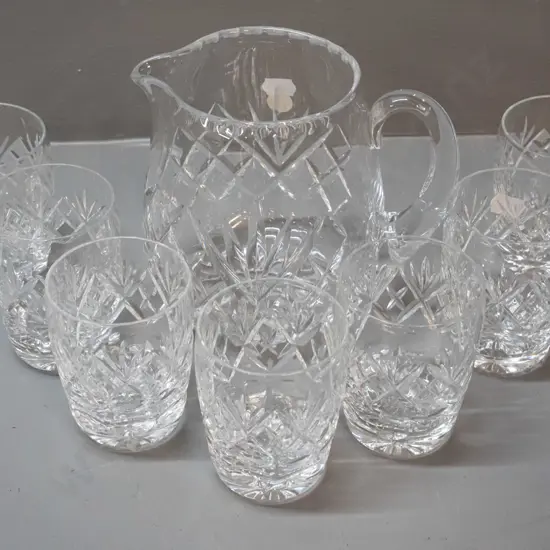 Webb-Corbett cut crystal water jug H-135 W-150 and 7 tumblers