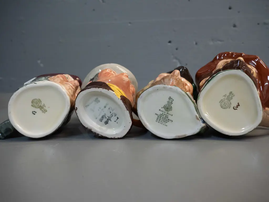 4 small character jugs - 3 Royal Doulton - Sir Francis Drake, Robin Hood, Simon The Cellarer - and one other H-110 Image 1++