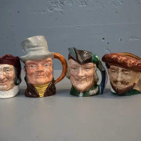 4 small character jugs - 3 Royal Doulton - Sir Francis Drake, Robin Hood, Simon The Cellarer - and one other H-110