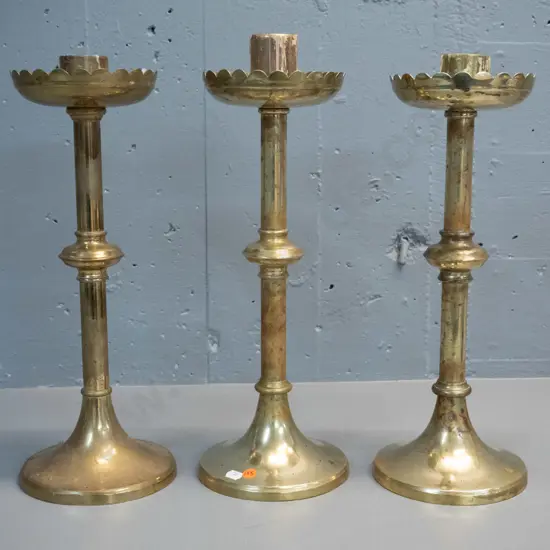 3 brass ecclesiastical style candle holders - some age wear & wax residue H-430