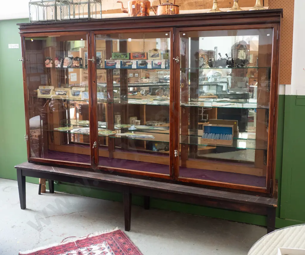 Edwardian shop display cabinet with 3 glazed doors, twist lock handles on separate table base with tapered legs Image 1++