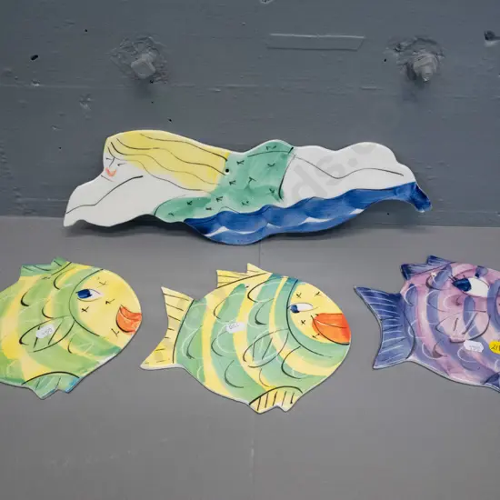 3 wall hanging pottery fish and a swimming woman H120 L380 - all from Laughing Fish Studio, Mapua NZ
