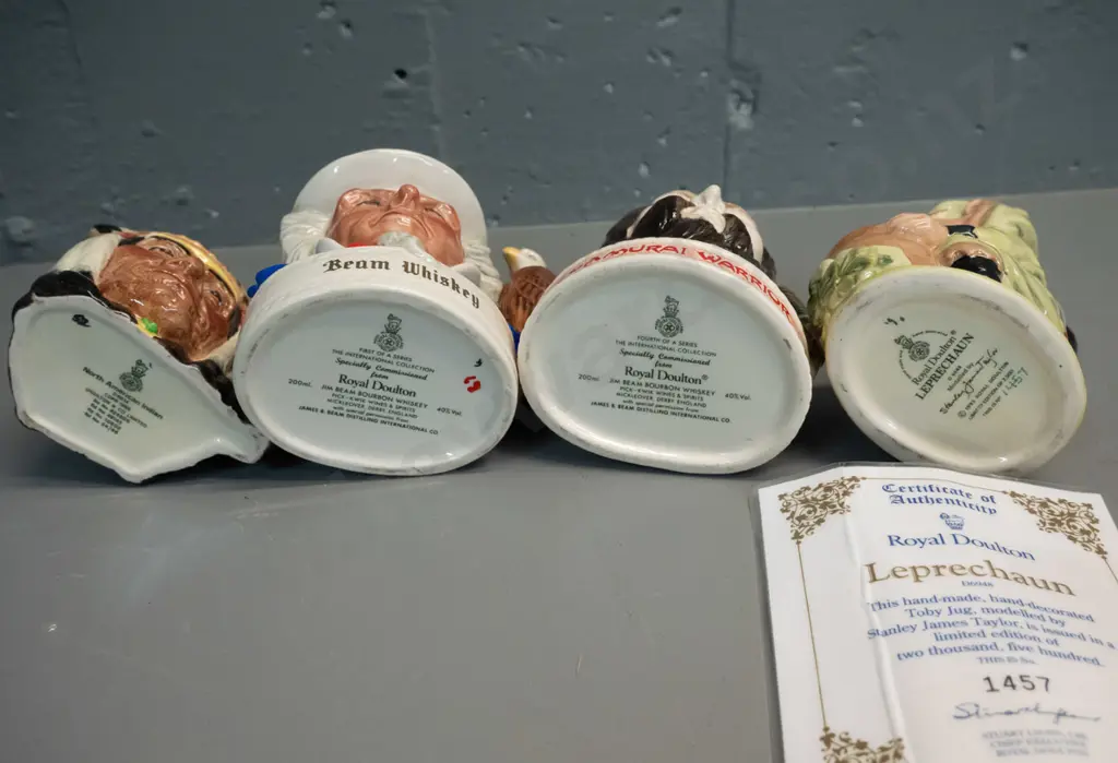 4 small Royal Doulton character jugs - First nations chief, limited edition Leprechaun w/certificate H140, 2 x Jim Beam Image 1++