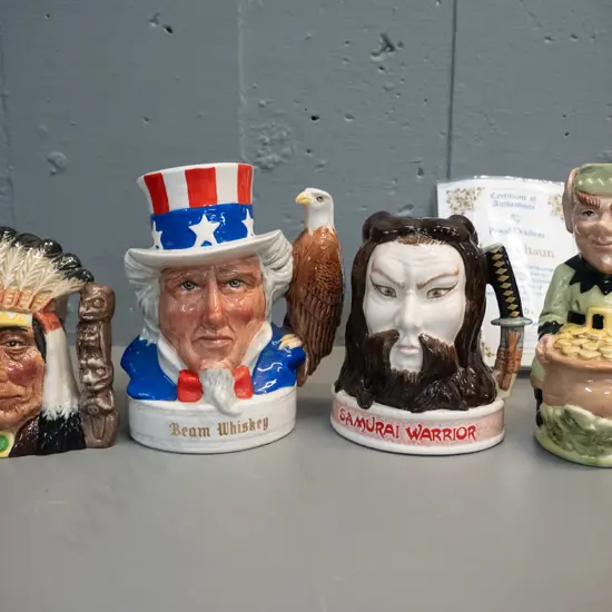 4 small Royal Doulton character jugs - First nations chief, limited edition Leprechaun w/certificate H140, 2 x Jim Beam