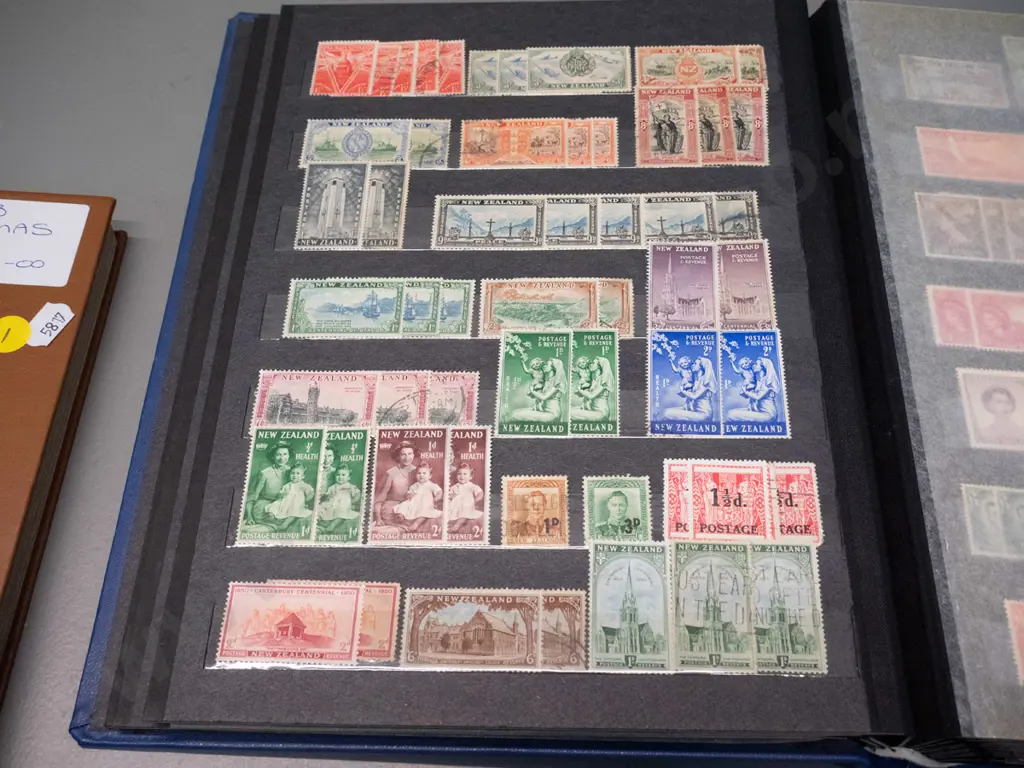 2 New Zealand stamp albums - one is 1900 to 1999, other is Christmas stamps Image 1++