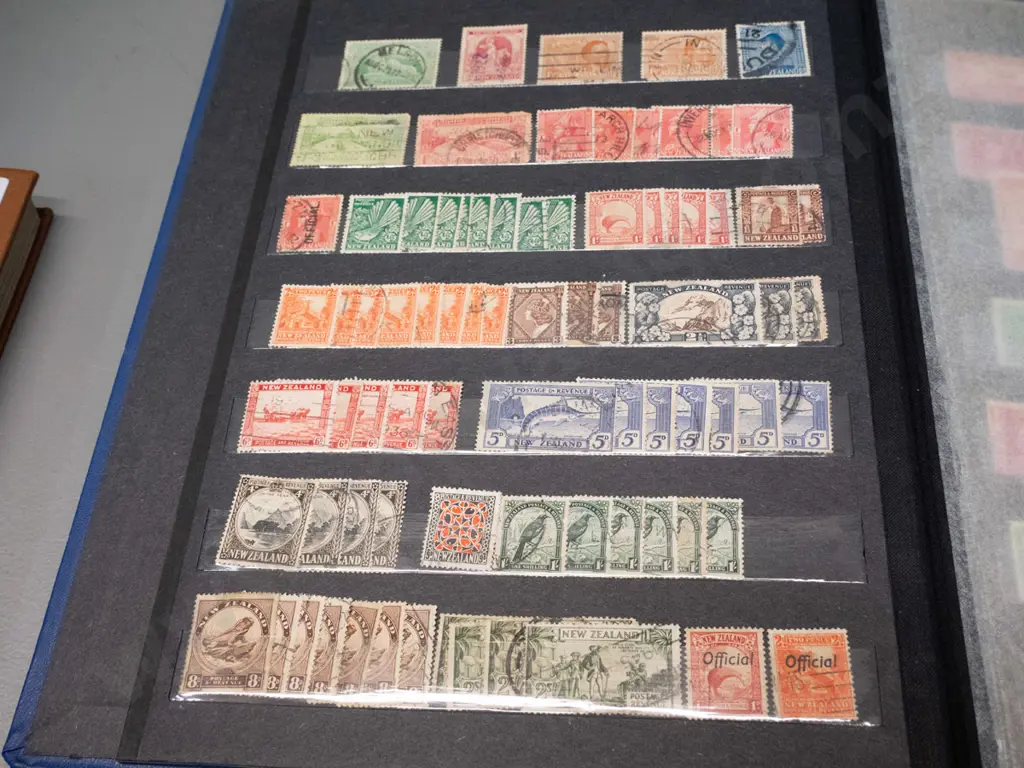 2 New Zealand stamp albums - one is 1900 to 1999, other is Christmas stamps Image 1++