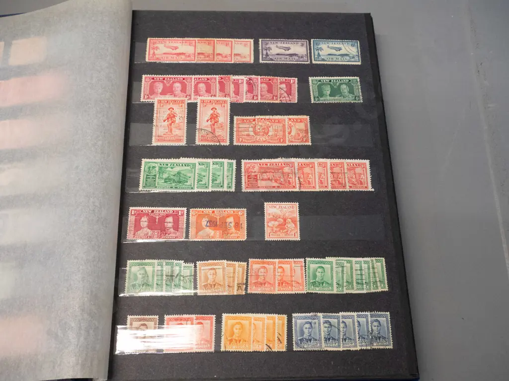 2 New Zealand stamp albums - one is 1900 to 1999, other is Christmas stamps Image 1++