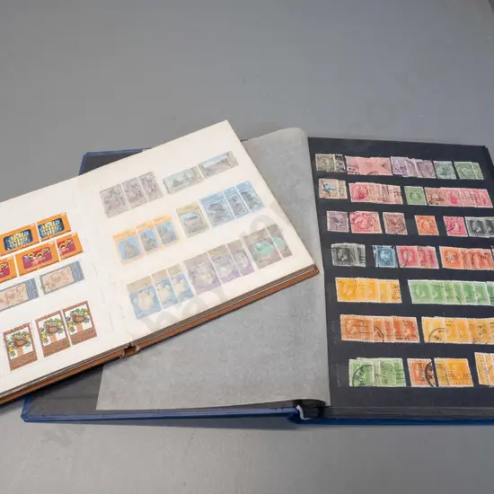 2 New Zealand stamp albums - one is 1900 to 1999, other is Christmas stamps